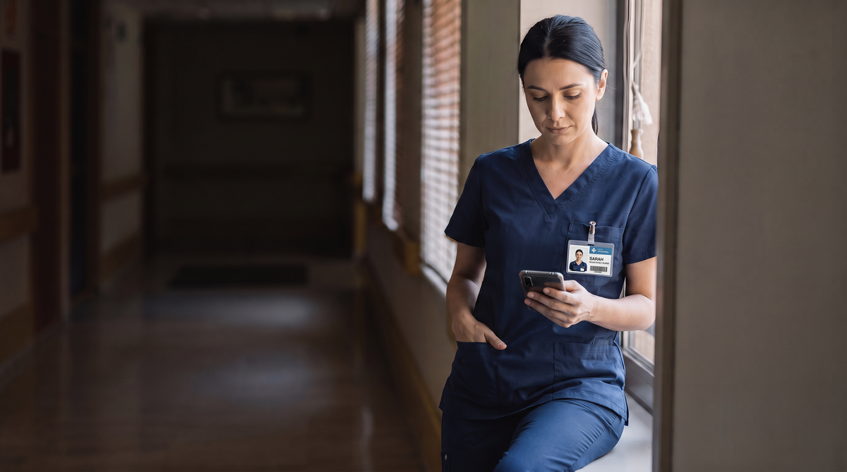 A nurse walking a hospital corridor between rotations