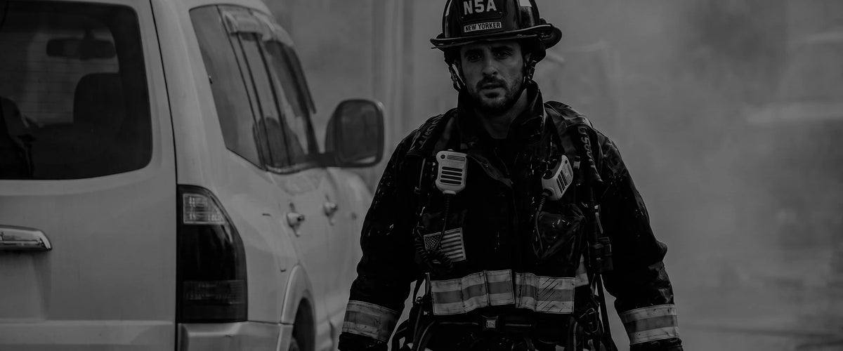 Firefighter walking past a response van after a call